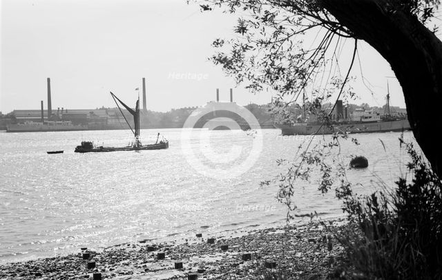 A Thames sailing barge on the River Thames at Tilbury, Essex, c1945-c1965.  Artist: SW Rawlings