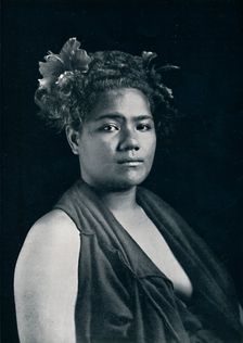 A Tongan woman, with scarlet hibiscus blossoms in her hair, 1902. Artist: JJ Lister