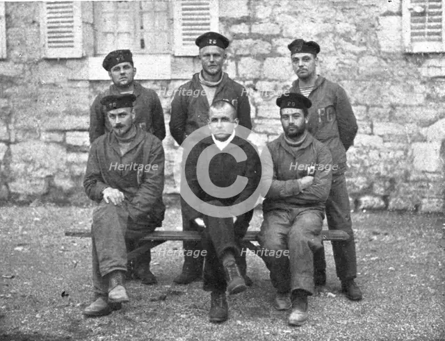 A torpedoing immediately avenged; The commander of 'UC-38', seated in the middle..., 1917. Creator: Unknown.
