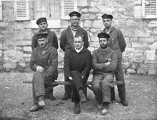 A torpedoing immediately avenged; The commander of UC-38 seated in the middle..., 1917. Creator: Unknown
