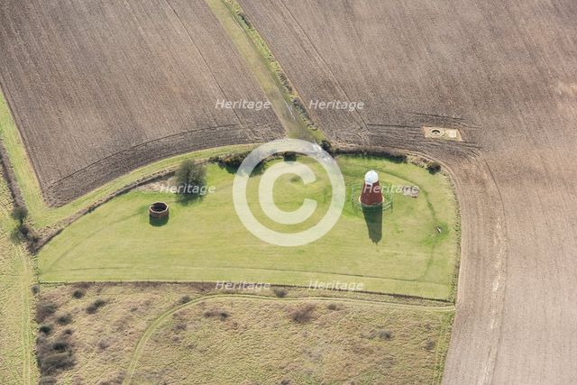 A tower windmill and World War II searchlight emplacements on Halnaker Hill, West Sussex, 2018. Creator: Damian Grady.