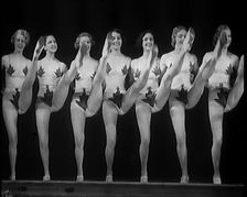 A Troupe of Dancers Wearing Fig Leaf Costumes Synchronised Dancing in Front of an Audience..., 1931. Creator: British Pathe Ltd