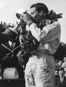 A trophy of champagne for driver Jim Clark, winner of the Aintree 200 race, April 1962