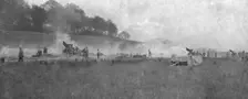 A travers le champ de bataille; notre avance vers Lassigny: batterie francaise de 155 en..., 1918. Creator: Unknown