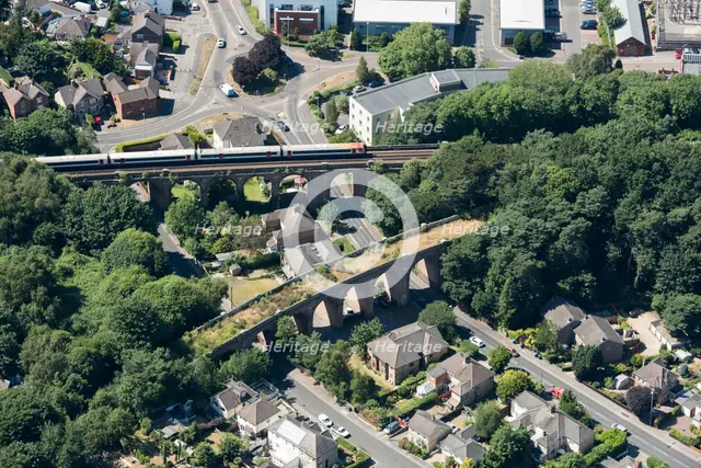 A train crossing a viaduct on the Poole and Bournemouth Railway, Poole, Dorset, 2018. Creator: Historic England.