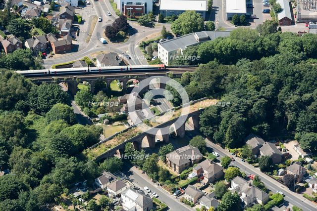 A train crossing a viaduct on the Poole and Bournemouth Railway, Poole, Dorset, 2018. Creator: Historic England.