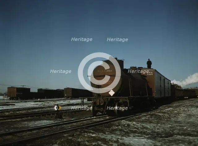 A train (or "cut") being pushed out of a receiving..., Proviso yard, C & NW RR., Chicago, Ill., 1942 Creator: Jack Delano.