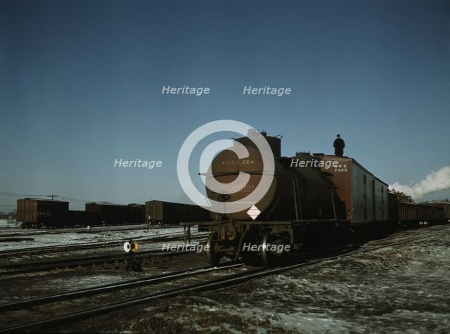 A train (or "cut") being pushed out of a receiving..., Proviso yard, C & NW RR., Chicago, Ill., 1942 Creator: Jack Delano.
