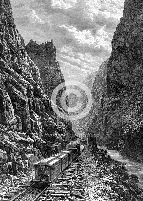 A train passing through the Rocky Mountains, USA, 19th century.Artist: Taylor