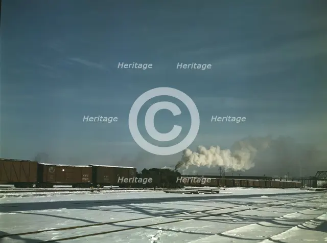 A train pulling out of the freight house at C & NW RR's Proviso(?) yard, Chicago, Ill., 1942. Creator: Jack Delano.