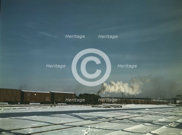 A train pulling out of the freight house at C & NW RR's Proviso(?) yard, Chicago, Ill., 1942. Creator: Jack Delano.
