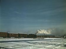 A train pulling out of the freight house at C & NW RR's Proviso(?) yard, Chicago, Ill., 1942. Creator: Jack Delano