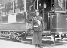 A tram conductor in her winter uniform, possibly in Glasgow, 1915