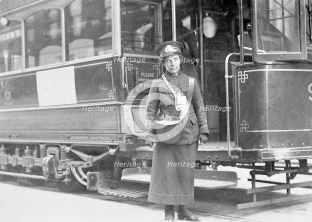 A tram conductor in her winter uniform, possibly in Glasgow, 1915. Artist: Unknown