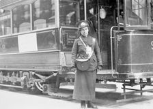 A tram conductor in her winter uniform, possibly in Glasgow, 1915. Creator: Unknown