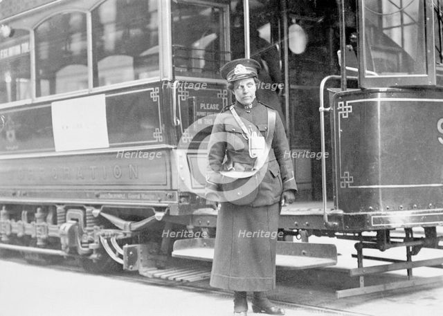 A tram conductor in her winter uniform, possibly in Glasgow, 1915. Creator: Unknown.