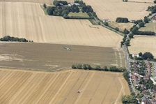 A two seat Spitfire in flight near Goodwood Aerodrome, West Sussex, 2020. Creator: Damian Grady