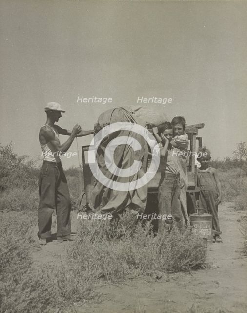 A tubercular painter from Iowa and part of his family... penniless in New Mexico, 1937. Creator: Dorothea Lange.