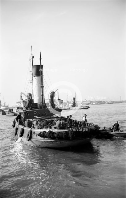 A tug leaving the Royal Terrace Pier at Gravesend, Kent, c1945-c1965. Artist: SW Rawlings