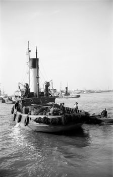 A tug leaving the Royal Terrace Pier at Gravesend, Kent, c1945-c1965. Artist: SW Rawlings