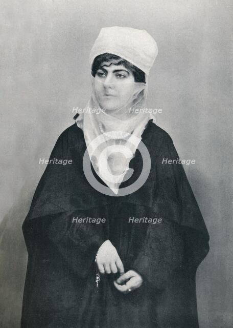 A Turkish lady in outdoor costume, 1912. Artist: Unknown.