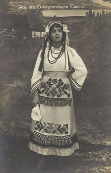 A Ukrainian prisoner of war performing a dance at a prisoner... (between 1910 and 1919?). Creator: Paul Tharan