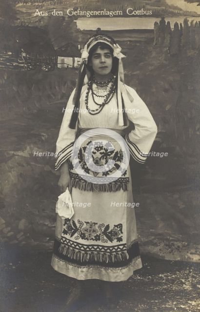 A Ukrainian prisoner of war performing a dance at a prisoner... (between 1910 and 1919?). Creator: Paul Tharan.