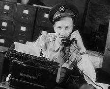 A Uniformed Journalist Working, 1943. Creator: British Pathe Ltd