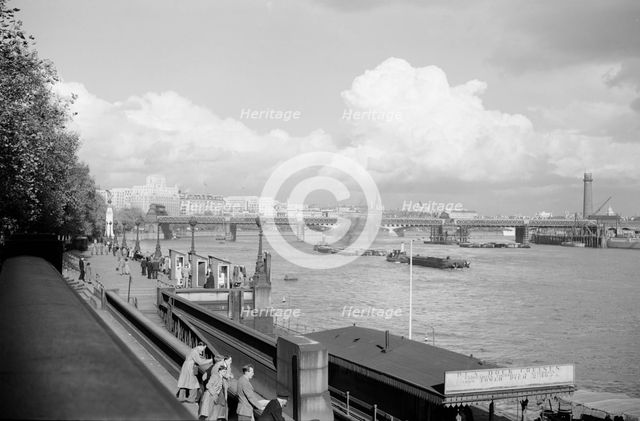 A view of Hungerford Bridge and River Thames, Lambeth, London, c1945-1965. Artist: SW Rawlings