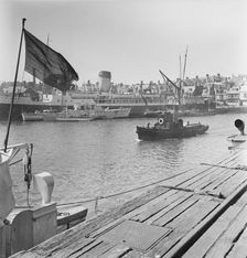 A view of the harbour at Weymouth showing various vessels including SS St Julien, 1948. Creator: John Laing plc