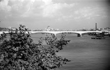 A view eastwards along the River Thames to Waterloo Bridge and the City of London, c1945-c1965 Artist: SW Rawlings