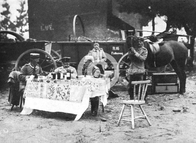 'A Vise, des officiers allemands degustent en plein air les vins requisitionnes', 1914. Creator: Unknown.