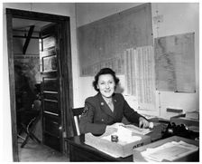 A WAC sitting at a desk in an office, Fort Sheridan, Illinois, USA, 1945