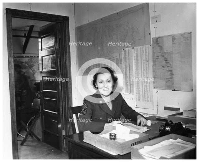 A WAC sitting at a desk in an office, Fort Sheridan, Illinois, USA, 1945. Artist: Unknown
