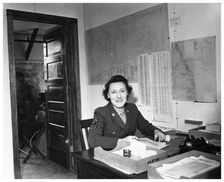A WAC sitting at a desk in an office, Fort Sheridan, Illinois, USA, 1945