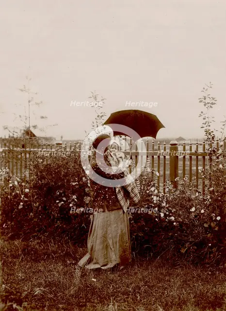 A walk in the garden at the Yudins' dacha in Tarakanovo, 1903. Creator: Unknown.