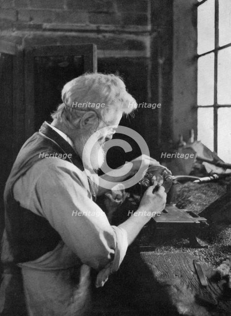 A watch cap maker at work, 1911-1912.Artist: AL Hitchin