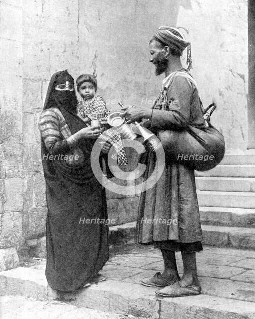 A water seller, Cairo, Egypt, 1936.Artist: Donald McLeish