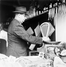 A weights and measures officer, London, (c1950-c1970?). Creator: Henry Grant