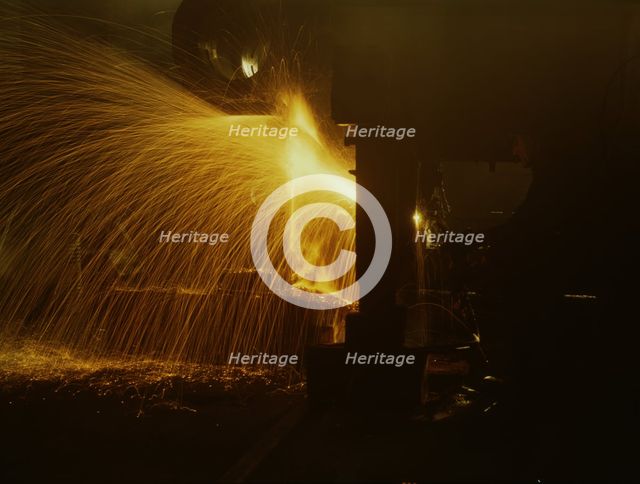 A welder who works in the round-house at the Chicago and Northwestern Railroad's Proviso yard, 1942. Creator: Jack Delano.