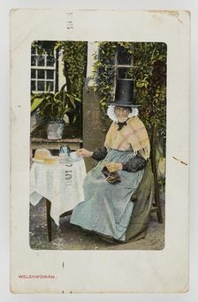 A Welsh woman at tea table with knitting on her lap, c1900. Creator: Unknown