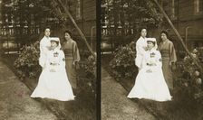 A western Red Cross female doctor(?) and two Japanese women posed in a garden, c1905. Creator: Underwood & Underwood