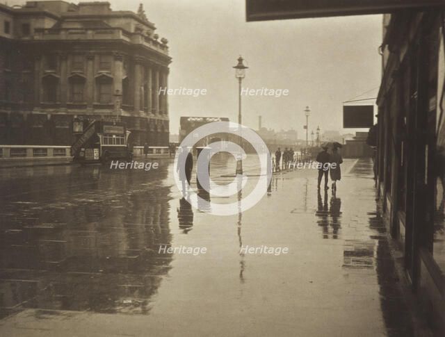 A wet day in Wellington Street. From the album: Photograph album - London, 1920s. Creator: Harry Moult.