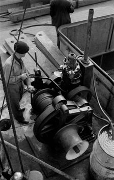 A winchman at work on the River Thames, London, c1945-c1965. Artist: SW Rawlings