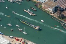 A wind turbine blade aboard a barge, on the River Medina, Cowes, Isle of Wight, 2021 Creator: Damian Grady