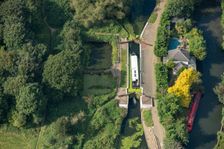 A widebeam canal boat ascending the Hanwell Lock Flight on the Grand Union Canal, London, 2021. Creator: Damian Grady