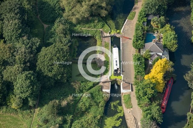 A widebeam canal boat ascending the Hanwell Lock Flight on the Grand Union Canal, London, 2021. Creator: Damian Grady.