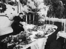 A widow grieving for her husband at a wake, Sweden. Creator: Unknown