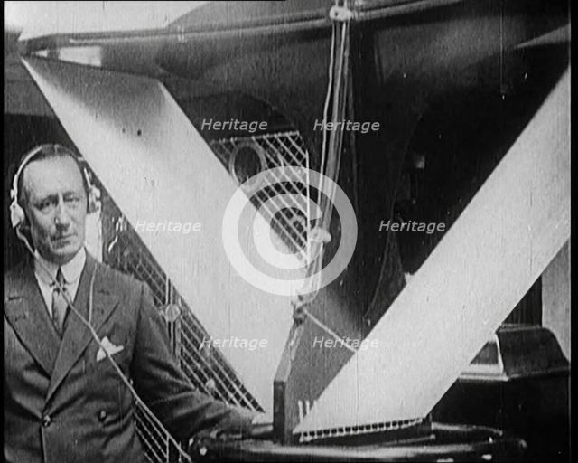 A Wireless Radio Aerial Spinning as Guglielmo Marconi Attempts to Receive a Signal, 1922. Creator: British Pathe Ltd.