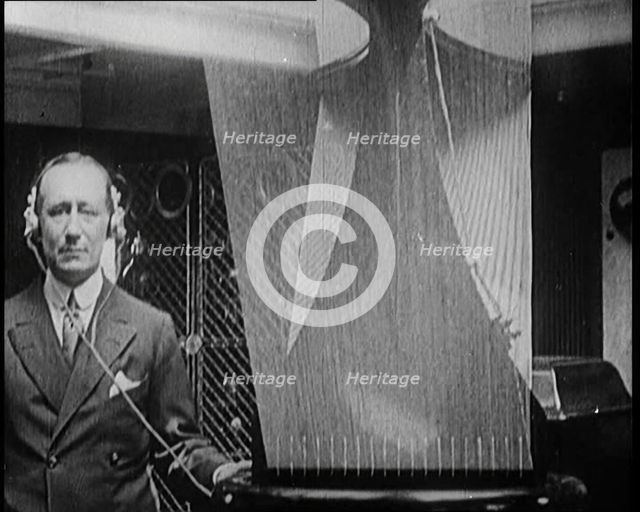 A Wireless Radio Aerial Spinning as Guglielmo Marconi Attempts to Receive a Signal, 1922. Creator: British Pathe Ltd.